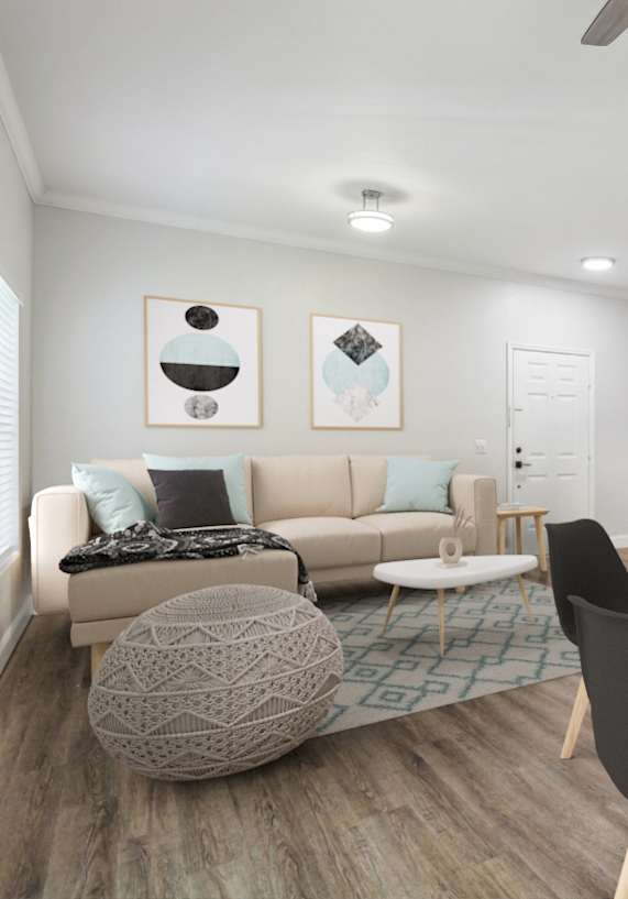 A modern living room with a round table and chairs.